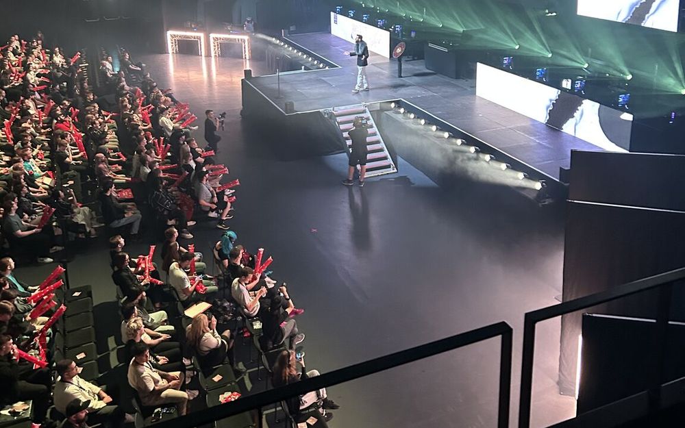 Fans with red thundersticks fill the stands facing the main stage at K.B. Hallen
