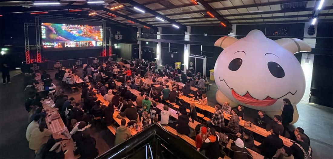 A packed NLC watch party at The Nest, Nottingham, with a giant inflatable Poro